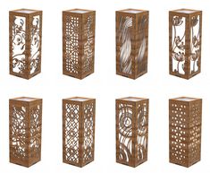 six wooden lanterns with intricate designs on them, all in different shapes and sizes to match