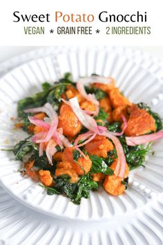 sweet potato gnocchi with spinach and red onions on a white paper plate