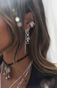 Edgy Necklace Layering, Chunky Ear Piercings, Silver Jewelry On Tan Skin, Earring Curation Silver, Silver Goth Jewelry, Spiritual Silver Jewelry, Ear Piercings Punk, Earring Stacks Silver, Silver Ear Stack