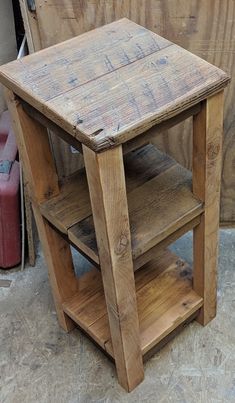 a small wooden table sitting on top of a hard wood floor