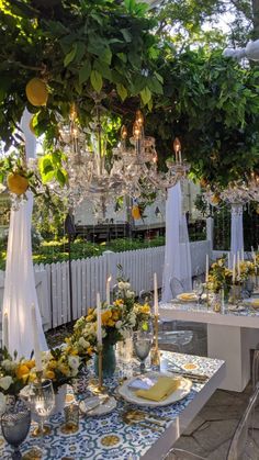 Outdoor picnic event, green white and yellow flowers, blue white green yellow decor, outdoor chandelier, tuscan themed dinner Blue Outdoor Wedding, Tuscan Dinner, Wedding Venue Decor, Italy Party, Intimate Dinner Party, Diner Party, Italian Party, Italian Theme