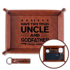 a brown leather tray with an inscription on the front and two keys in it that says i have two titles uncle and godfath and i rock them