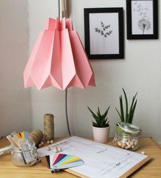 a table topped with lots of different types of crafts and items on top of it