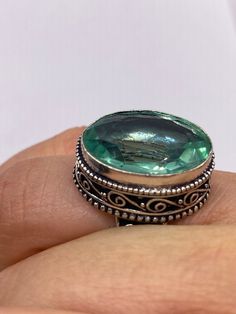 Large brilliant emerald green antique glass  Ornate German Silver  NOT 925  Vintage ring, does not tarnish Size 7.5 can be re sized, my jeweler charges a $20 fee All rings are shipped free in the US in a nice gift box.   Check out our over a THOUSAND great reviews Engraving is $4 per letter and is not always perfect depending on the piece. It can take a few days if the jeweler is busy. This is payable to Paypal Judithsltd@gmail.com Green Sterling Silver Topaz Ring, Green Oval Topaz Ring In Sterling Silver, Bohemian Green Rings For Anniversary, Green Oval Crystal Ring In Sterling Silver, Oval Green Crystal Sterling Silver Ring, Vintage Green Crystal Ring For Anniversary, Antique Emerald Ring For May Birthstone Gift, Silver Oval Crystal Ring For May Birthstone, Silver Emerald Ring With Vs Clarity And Oval Shape