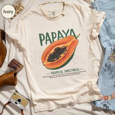 Comfort Colors® Trendy Papaya Cottagecore Shirt Aesthetic Fruit T-Shirt Retro Local Farmers Market Fruity Tee Summer Papaya Print Top Gift Trendy Fruit Shirt S Up to 4XL Our Comfort Colors® t-shirt is a soft-washed, garment-dyed fabric that brings extra coziness to your wardrobe while the relaxed fit makes it an excellent daily choice. The double-needle stitching throughout the tee makes it highly durable while the lack of side-seams helps the shirt retain its tubular shape. *Original design *Re Banana T Shirt, Fruit T Shirt Design, Fruit Tshirt Design, Papaya Aesthetic, Fruit Outfits, Papaya Print, Farmers Market Outfit, Aesthetic Fruit, Fruit Shirt