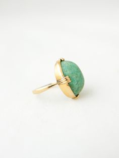 Natural, unpolished jade dome ring set in 18k gold band. Unusual & unmarked. Maker unknown. Antique estate find and likely 100+ years old based on the home and other antiques. Because this is a dome and sits fairly high there is room to fit up to 5.5 ring finger. Tests as 18k gold Size 5 Dome 3/4" x 1/2" Gemstone Dome Ring For Wedding, Vintage Yellow Gold Oval Turquoise Ring, Vintage Dome Ring As A Gift, Vintage Domed Ring For Gift, Vintage Domed Ring As A Gift, Yellow Gold Domed Gemstone Ring, Vintage Yellow Gold Turquoise Oval Ring, Unique Yellow Gold Oval Dome Ring, Unique Oval Dome Ring In Yellow Gold