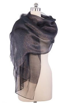 A sheer, shimmering scarf that will quickly become your go-to piece for going out. Bonus: it looks gorgeous as both a wrap and a scarf. 28" x 75" (one size) Pattern: Solid 100% silk Hand wash Imported Black Sparkly Scarf, Celestial Shawl, Evening Wraps, Dream Dresses, Scarf Material, Fashion Marketing, Wrap Scarf, Silk Wrap, Fashion Business