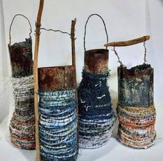 four vases made out of different materials