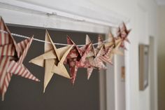 an origami star hanging from a string