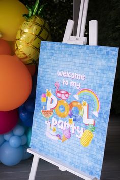 a welcome to my pool party sign in front of some balloons and pineapples