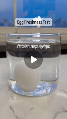 an egg is floating in a bowl of water