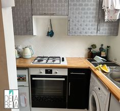 a kitchen with a stove top oven next to a dishwasher and dryer