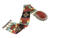 Chili Rose Mini Aragon Black Fortuna Bracelet Carnelian Stone lays in the middle of the Bracelet when on the wrist -19mm wide -Hand Beaded on a Loom -Red, Turquoise, Jet and Olive colored Beads -Sterling Silver -Interlocking Clasp Closure -Made in Santa Fe, New Mexico -Length: 7in. -*Length can be custom made, just let us know at checkout! Anything over 8in. is an additional charge* Artisan Polished Beads Bracelet As Gift, Traditional Gemstone Bead Bracelet, Artisan Bracelets With Polished Beads, Bohemian Adjustable Bracelets With Cabochon, Traditional Multicolor Gemstone Beads Bracelets, Traditional Multicolor Gemstone Beads Bracelet, Artisan Cabochon Bracelet Jewelry, Bohemian Cabochon Bracelets As Gifts, Artisan Gemstone Beads Round Bracelets