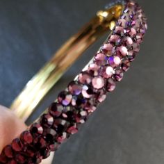 Purple Rhinestone Bangle Bracelet 7.5 In Diameter, Never Worn. Gold Tone Interior And Tab Closure Purple Round Crystal Party Bracelet, Purple Rhinestone Bracelets As Gift, Purple Rhinestone Bracelets Perfect For Gifts, Purple Rhinestone Bracelets For Gifts, Purple Crystal Bracelets, Purple Crystal Bracelet For Party, Adjustable Purple Rhinestone Bracelets, Adjustable Purple Bracelets With Rhinestones, Adjustable Purple Rhinestone Jewelry