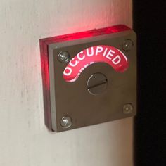 Model D-100 L.E.D. with Red Acrylic Mounting Bracket is the ultimate bathroom privacy indicator door lock with lighted occupied signage.  All of the electronics are housed on the back of the message disc including the battery.  It is surface-mounted to make installation on most doors easy.  The Red Acrylic Mounting Bracket glows red along with the OCCUPIED sign when the door is locked.  You'll be able to see if the room is occupied from any angle and distance up to 1000 feet. The photoluminescen Occupied Sign, Privacy Door, Battery Holder, Bathroom Doors, Red Door, Sign Lighting, Bathroom Signs, Red Led, Mounting Brackets