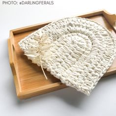 a crocheted dishcloth on a wooden tray