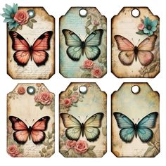 four tags with butterflies on them and roses around the edges, all decorated in pink and blue