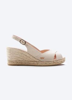 These stylish and flirty Llansa canvas wedges have a flattering slingback heel, an elegant buckle and soft cotton, 100% organic canvas for a comfortable, luxurious fit. And with a gorgeous 2 ½” heel, they’re comfortable enough to get you from sunny days to stylish nights. TOP TIP: STYLING Sexy and stylish, these handmade espadrille wedges feature eco-friendly jute soles for natural breathability, the perfect party shoes for those hot summer evenings. Medium Wedges, Sandal Wedges, Sell Shoes, Comfortable Wedges, Wedge Espadrilles, High Shoes, Gorgeous Shoes, Slingback Heel, Espadrille Sandals