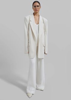 Billie Oversized Blazer - Cream – The Frankie Shop Classic Single-breasted Semi-formal Pantsuit, Timeless Suit With Lapel Collar And Pockets, Classic Single-breasted Pantsuit For Semi-formal Occasions, Timeless Blazer With Pockets And Suit Collar, Semi-formal Notched Suit With Pockets, Semi-formal Notched Suits With Pockets, Classic Semi-formal Pantsuit With Concealed Placket, Business Long Sleeve Pantsuit With Pockets, Classic Formal Blazer Dress With Concealed Placket