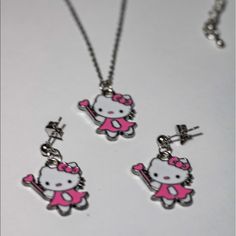 High Quality Silver Stainless Steel Hello Kitty Necklace And Earrings Set. Features 1. Material: Stainless Steel ,Green Vacuum Plating Nickle And Lead Free. High Quality. 2. Pendant Size:11mm*13mm Necklace Chain Length:41cm,Weight:3g 3. Color:Steel Hello Kitty Sterling Silver Necklace, White Sterling Silver Hello Kitty Jewelry, Cute Metal Jewelry With Cat Design, Hello Kitty Sterling Silver Jewelry Gift, Pink Hello Kitty Sterling Silver Jewelry, Cute Silver Dangle Jewelry, Cute Cat Design Dangle Jewelry, Clear Things, Hello Kitty Necklace