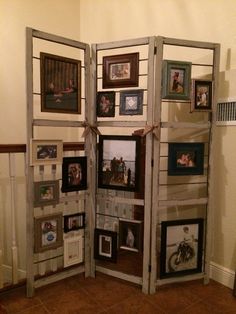 a room divider made out of wood with pictures on the sides and photos on the inside