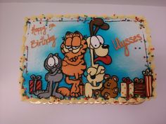 a birthday cake with garfield the cat and other cartoon characters on it's frosting