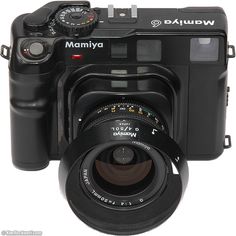 a black camera with a lens attached to it's body and the words mamiya written on its side