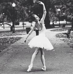 a black and white photo of a ballerina