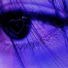 an eye is shown with the reflection of a heart in it's irise