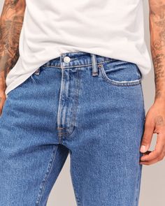 Step into the nostalgia of the 90s with Abercrombie & Fitch's Men's 90s Straight Jean. These jeans are the epitome of vintage cool with a relaxed fit through the thigh and a straight leg, elevated by a slightly higher rise. Perfect for those who cherish authentic 90s style, each pair is crafted from a vintage stretch fabric that offers both comfort and durability.

- Size: 29 X 32
- Color: Medium Wash
- Material: Cotton, Elastane
- Gender: Male
- Features: Frayed hem, relaxed fit, straight leg, Male Features, 90s Straight Jeans, Mens 90s, Men's Bottoms, Pocket Bag, Vintage Jeans, 90s Fashion, Mens Bottom, Straight Jeans