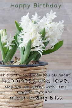 a birthday card with white flowers in a basket