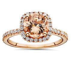 an oval shaped morganite and diamond ring in 18k rose gold with white diamonds