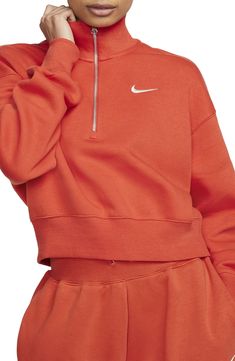 A roomy fit and cropped hem define this cozy half-zip sweatshirt with a brushed-fleece interior that's perfect for chillier days. Half-zip closure Stand collar 80% cotton, 20% polyester Machine wash, line dry Imported Nordstrom x Nike: A curated lifestyle destination where fashion is the ultimate sport Cheap Orange Nike Bottoms, Nike Sweatshirts Orange, Cropped Sweatshirt Outfit, Nike Sportswear Phoenix Fleece, Nike A, Sport Nike, Half Zip Sweatshirt, Nike Sports, Sweatshirt Outfit