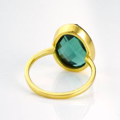 Get the "WOW" factor with this showstopper of a ring. The color of this tourmaline quartz stone is of a vibrant emerald green which is just stunning. Nicely sized with a soft teardrop or egg shape to it - one end is a bit more narrow than the other. Perfect in either 18k gold plated or 925 sterling silver. Gemstone size is 13mm x 16mm. Please note that due to the open back style of this ring, if you are between sizes, we recommend sizing down. Tourmaline Quartz, Green Tourmaline Ring, Bezel Set Ring, Aqua Chalcedony, Oval Ring, Oval Rings, Set Ring, Tourmaline Ring, October Birthstone