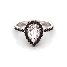 an oval shaped ring with black and white diamonds