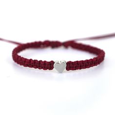 This bracelet is made of burgundy waterproof rope and a silver plated heart charm. Adjustable Burgundy Bracelets, Silver Heart Friendship Bracelets, Silver Heart-shaped Friendship Bracelets, Magic Bracelet, Winter Wishlist, Ribbon Awareness, Awareness Bracelet, Meow Meow, Braided Bracelets