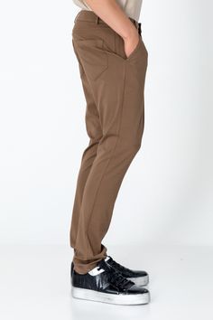 Elevate your everyday style with our men's casual wear pants, designed for both comfort and convenience. With a classic design featuring straight or tapered legs, they boast details like belt loops, pockets, and a zip fly with button closure for timeless appeal. Whether you're running errands or heading to a casual outing, these pants effortlessly adapt to any occasion. Versatile and stylish, they pair seamlessly with a range of tops, allowing you to create effortlessly put-together looks with e Mens Pants Fashion, Wool Suit, Suit Shop, Leather Pieces, Jacket Buttons, Knit Jacket, Casual Wear For Men, Fashion Pants, Casual Wear