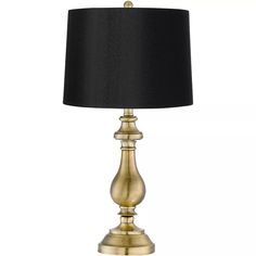 a gold lamp with a black shade on it