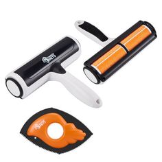 an orange and black hair clipper next to a pair of scissors on a white background