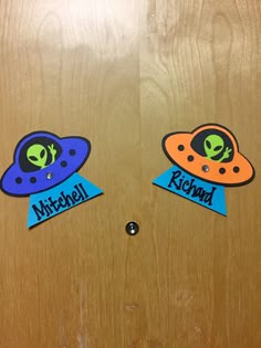 two stickers with aliens on them that say hitchhiker and kilchard