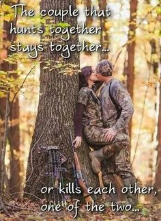 a couple kissing in the woods next to a tree with a quote on it that says,