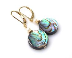 Natural flat round abalone earrings comes in your choice of boho sterling silver or elegant gold filled earrings closures and findings. Accented with a small white freshwater pearl. Sublime and beachy jewelry is perfect for women who love the ocean and summer fun in the sun!Earring Details:- Earring are 1.25 inches long (3.17 cm) with the earring closures shown- Abalone shells are 14 mm in diameter (.5 inches)- Choose sterling silver or 14k gold filled leverback earring closures via the drop dow Elegant Gold Abalone Shell Jewelry, Elegant Gold Jewelry With Abalone Shell, Anniversary Mother Of Pearl Round Earrings, Nickel-free Round Mother Of Pearl Jewelry, Elegant Abalone Shell Jewelry Gift, Elegant Handmade Abalone Shell Earrings, Abalone Shell Drop Earrings, Elegant Abalone Shell Jewelry For Gifts, Elegant Nickel Free Round Disc Earrings