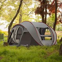 a tent is set up in the grass