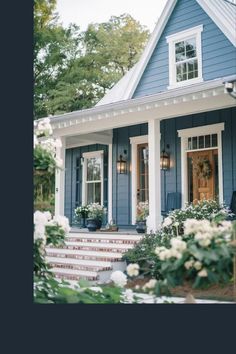 a blue house with white trim and windows