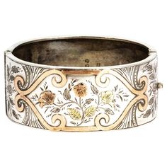 This gorgeous silver bangle has the most exquisite rose gold and yellow gold overlay. There is also engraving included in the decoration of this stunning piece. The overall feel of the design on the bangle is a girly floral style. Inner Diameter: 58mm Bangle Width: 27mm Luxury Antique Carved Bangle, Luxury Vintage Etched Bangle, Ornate Stamped Bangle Bracelet, Rose Gold Engraved Bangle For Wedding, Engraved Rose Gold Bangle Bracelet, Gold Sterling Silver Engraved Bracelet For Wedding, Gold Etched Sterling Silver Bracelet Gift, Gold Engraved Sterling Silver Bangle Bracelet, Gold Sterling Silver Bangle With Intricate Design