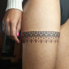 a woman's thigh with a tattoo on the lower part of her leg,