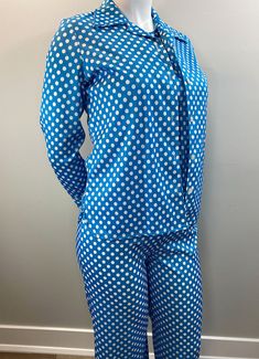 "Love this 3 piece set of pants, shell (tank) and blouse/jacket. The fabric is a clear blue and crisp white polka dot throughout all 3 pieces. The pants have an elastic waist and a flare to the leg. The shell (tank) is simple and easy with a crew neck. The blouse is kind of a shirt/jacket. Long sleeves with a great wide collar and white plastic buttons. The hem is curved to the side seams for a lovely feminine detail. Unlined. Slight stretch. Just fantastic! Great vintage size. Label: 100% Polye Retro Spring Workwear Sets, Retro Workwear Sets For Spring, Fitted Vintage Blue Set, Blue Fitted Vintage Set, Fitted Polka Dot Sets For Spring, Retro Long Sleeve Spring Set, Retro Fitted Blue Sets, Retro Blue Fitted Sets, Vintage Blue Long Sleeve Sets