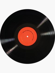 an orange and black record on a white background