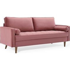 a pink couch sitting on top of a white floor