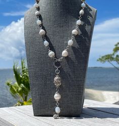 This freshwater pearl necklace is paired with moonstone faceted crystals and adorned by silver tone accents.  There are 11 freshwater creamy white freshwater baroque pearls on this lariat style necklace. The pearls range in size from 9-12mm. Each pearl has it's own personality and character traits that make them "perfectly imperfect." The baroque artisans described these unique pearls in this way and I couldn't agree more.  I love mixing pearls with other beads to create designs that can be worn Lariat Style Necklace, Character Traits, Moonstone Crystal, Freshwater Pearl Necklace, Freshwater Pearl Necklaces, Perfectly Imperfect, Faceted Crystal, Style Necklace, Baroque Pearls